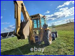 Ford 555B backhoe tractor 7' loader 63 hp diesel 2wd Cab with heat AC 24 bucket